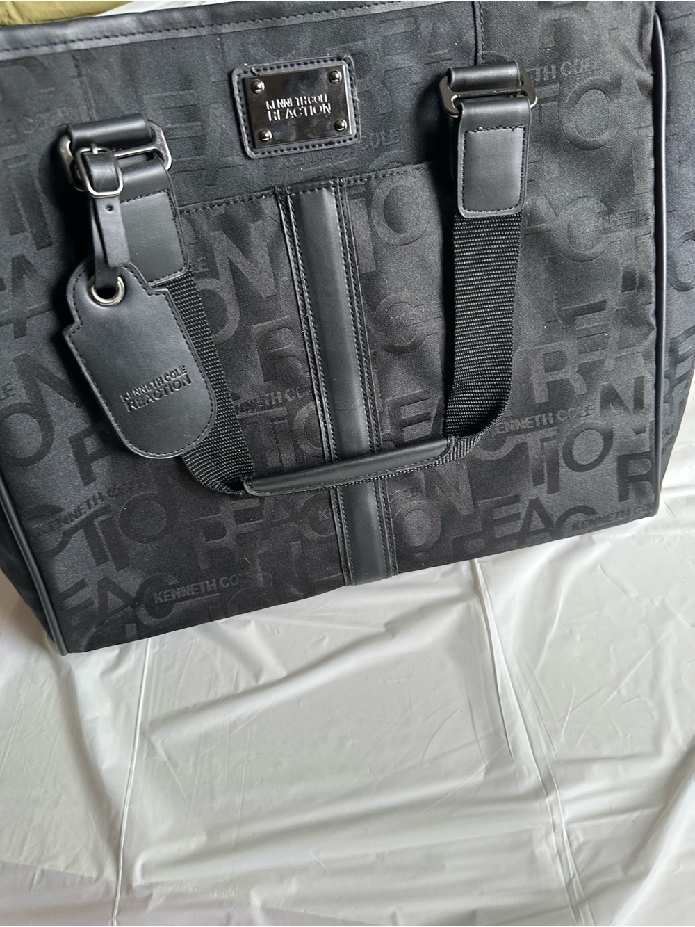 Kenneth Cole Reaction Black Monogram “Taking Control” shoppers and laptop tote.
